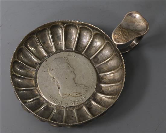 An early 19th century continental white metal taste vin with inset coin base, 67mm.